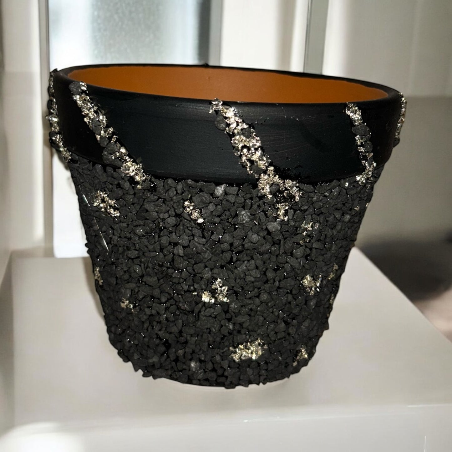 Black and silver terracotta pot
